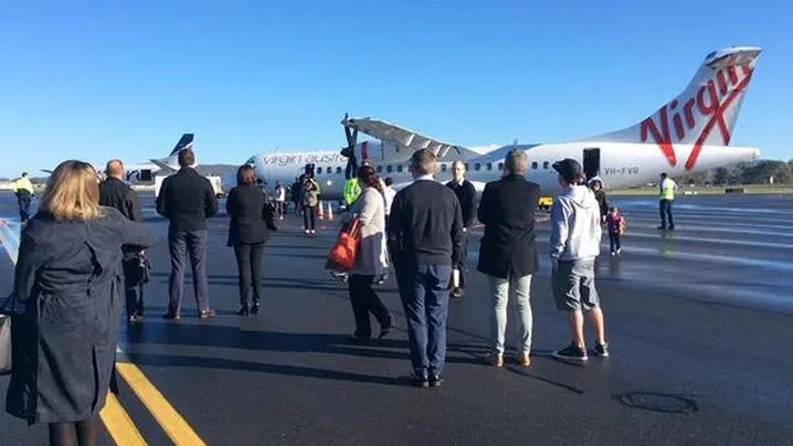 Another plane evacuated after second bomb threat in Australia.