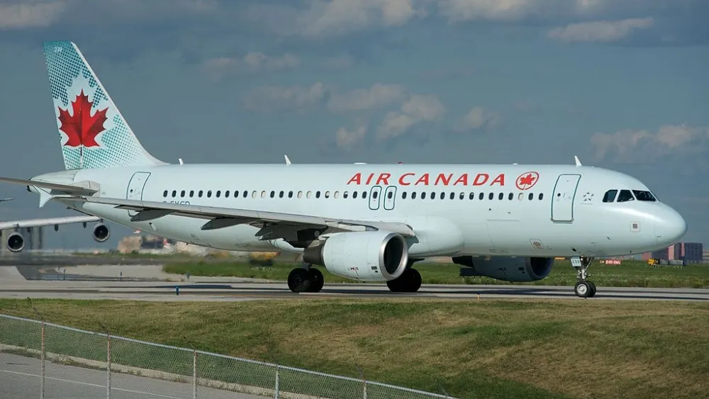 Air Canada plane lines up to land on crowded taxiway