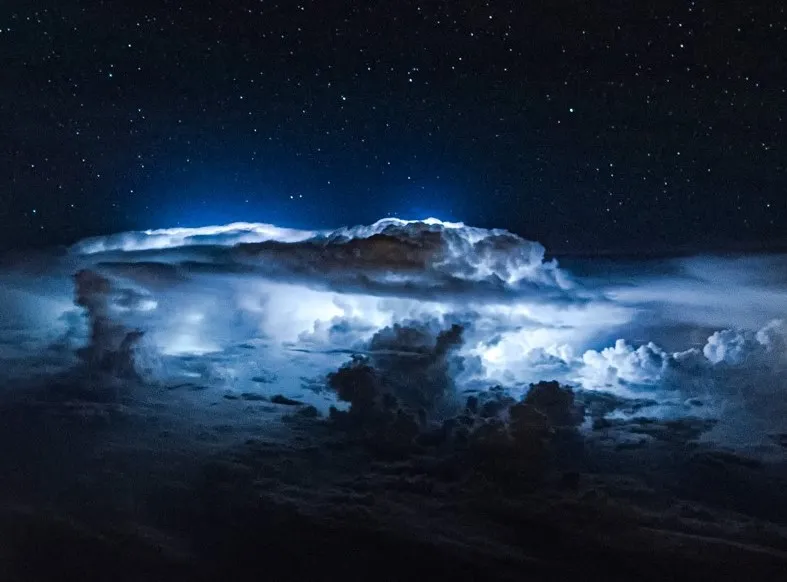 Spectacular thunderstorms under the stars from a 747 cockpit.